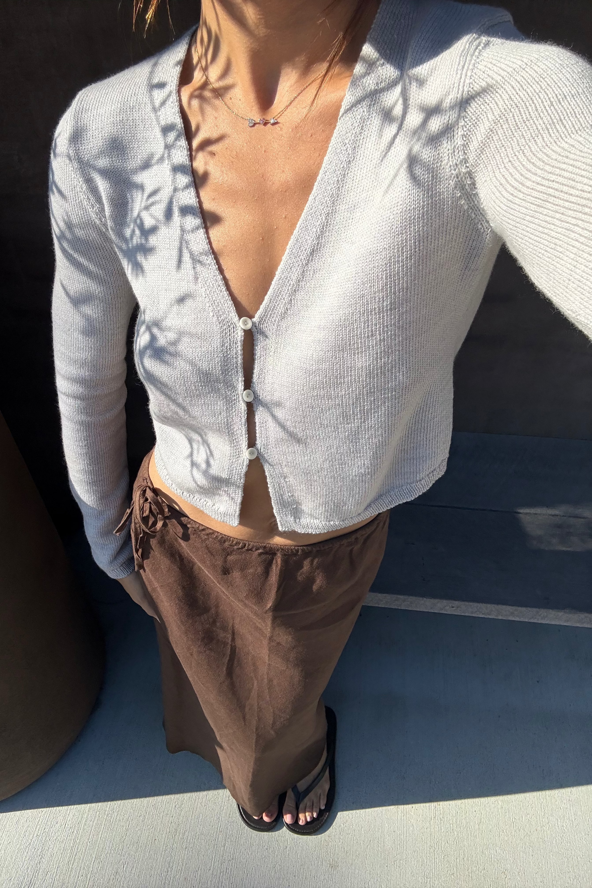 LILLY PILLY woman wearing a Taylor merino wool knit and Riley linen skirt