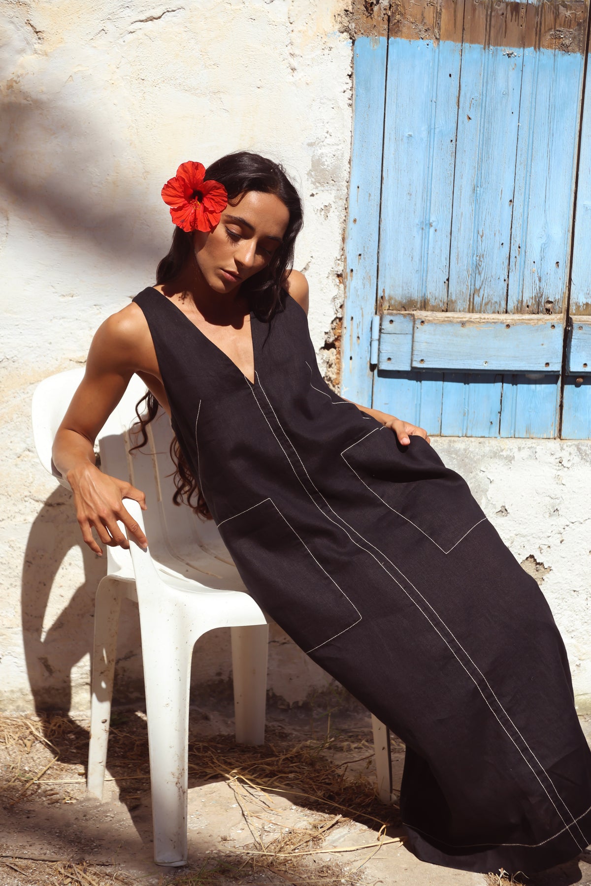 Woman in Iris Linen sleeveless midi dress, black with white contrast stitching, full view — Lilly Pilly Collection