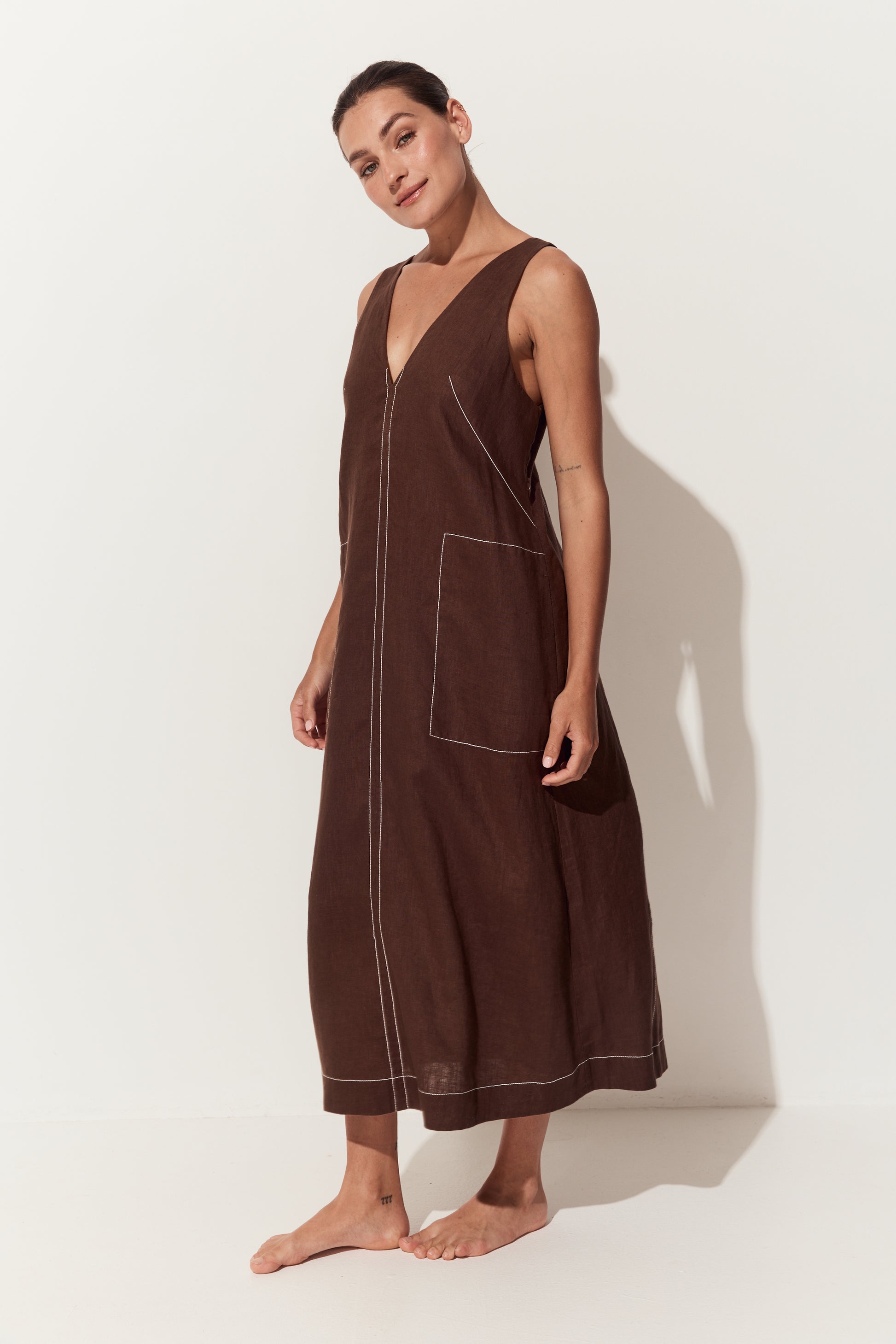 Iris Linen Midi Dress in Chocolate - three quarter view of dress with a deep V-neck, large front patch pockets - Lilly Pilly Collection