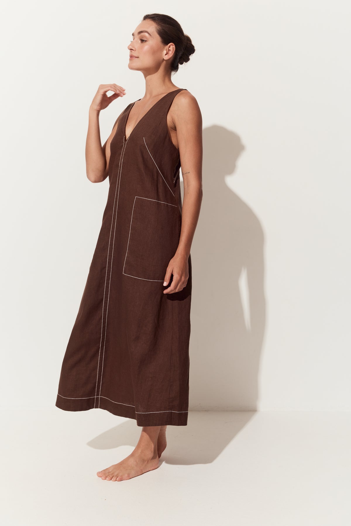 Iris Linen Midi Dress in Chocolate - side view of dress with a deep V-neck, large front patch pockets - Lilly Pilly Collection