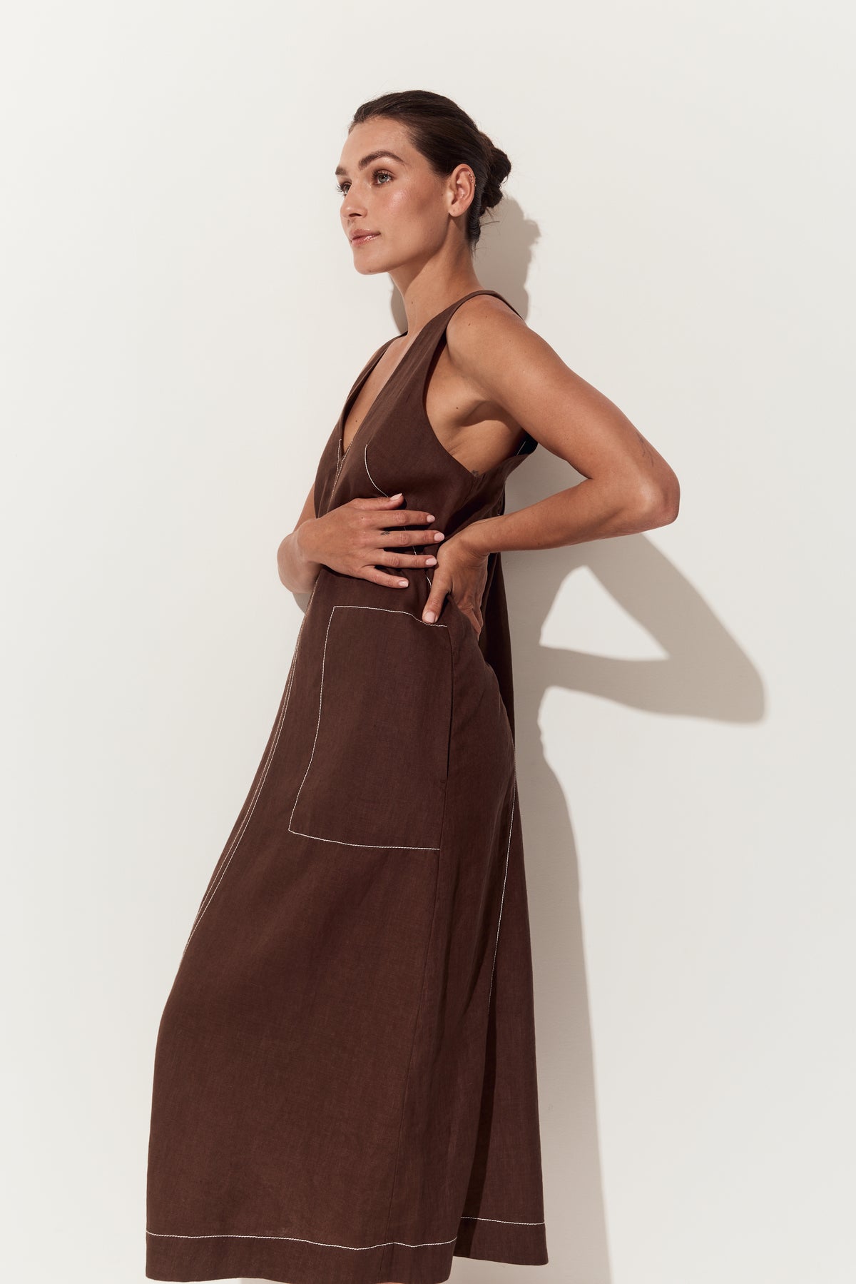 Iris Linen Midi Dress in Chocolate - side view with hands on waist - Lilly Pilly Collection