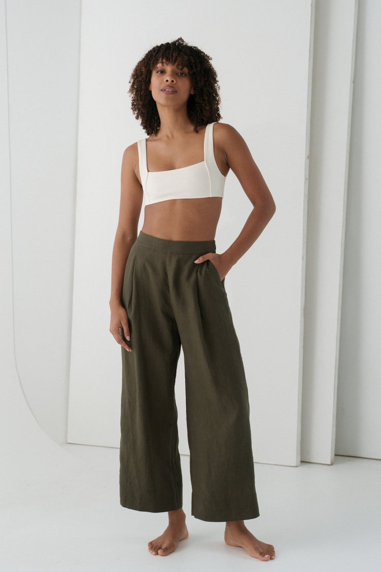 Ivy Linen Crop Pants in Khaki - full length front view, woman wearing Khaki wide-leg linen crop pants with ivory square-neck crop bra top, white studio backdrop - Lilly Pilly Collection
