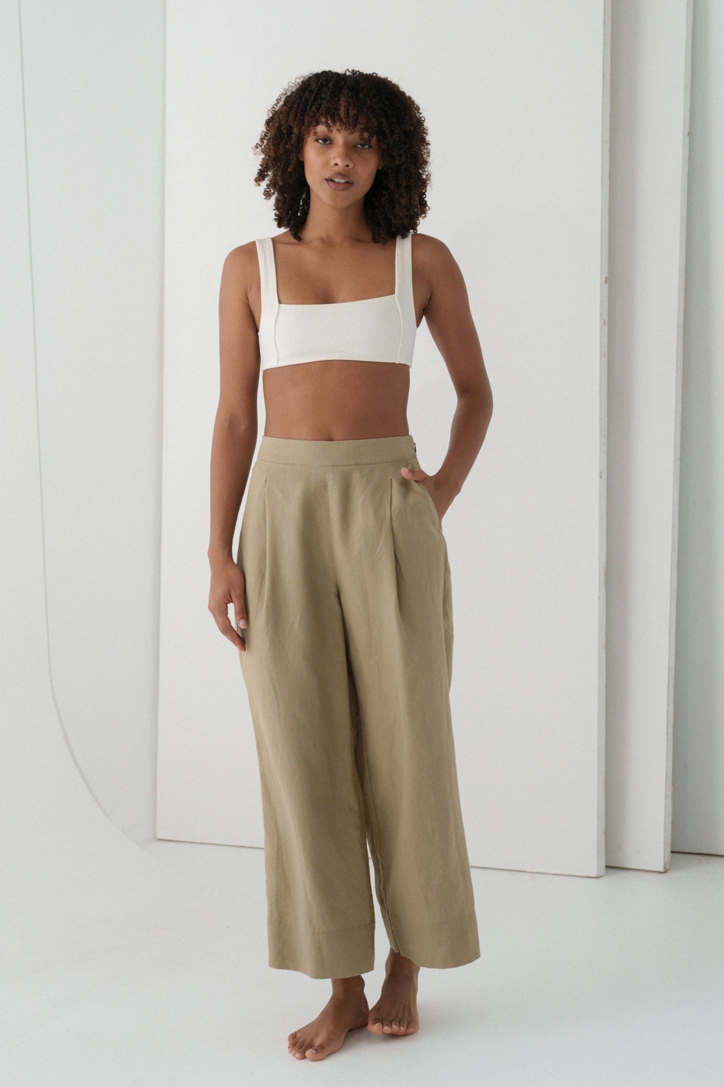 LILLY PILLY Ivy linen pants in Taupe in studio with white wall