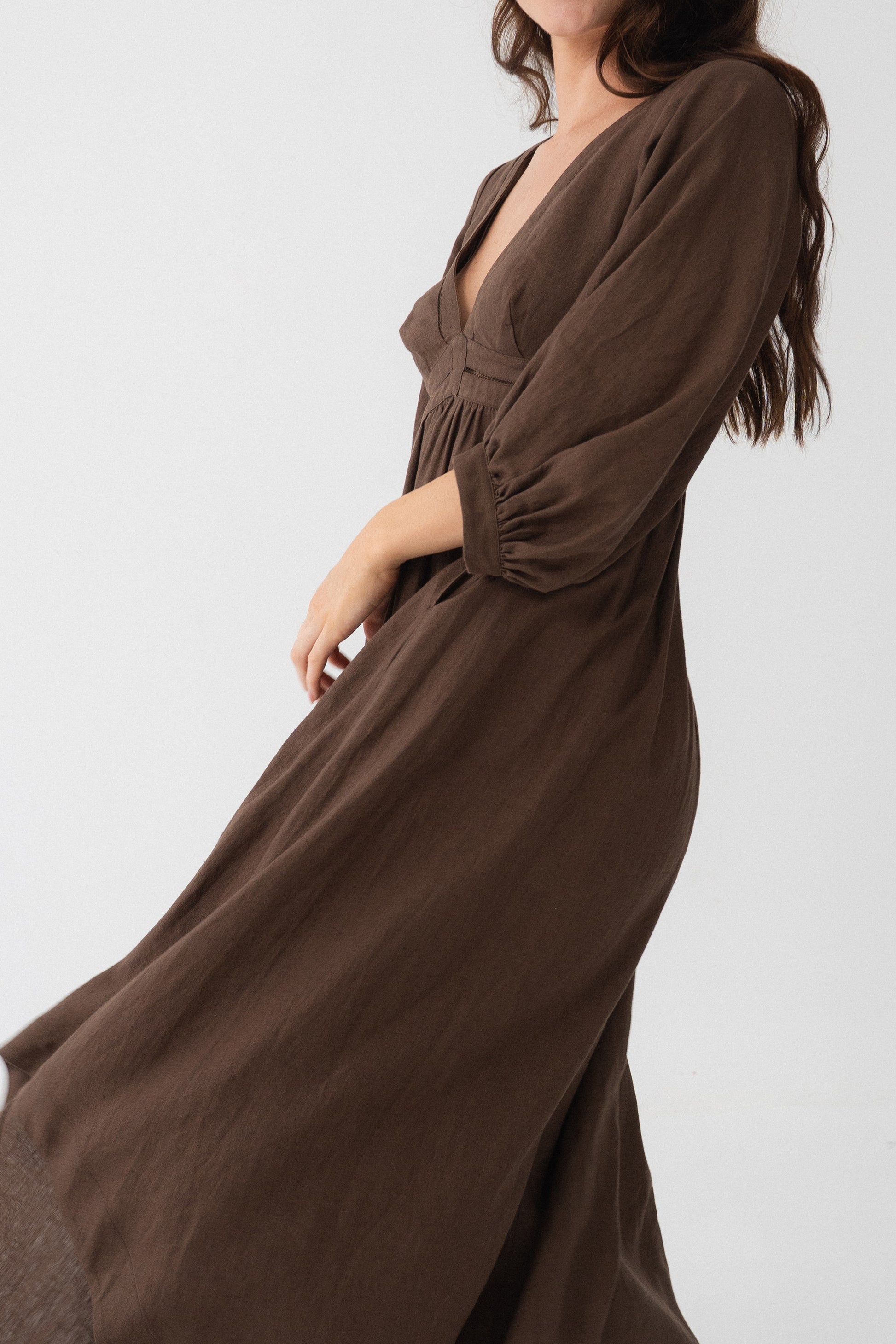 Josie Linen Midi Dress in Chocolate - side view showing flowy midi length and puff sleeve movement - Lilly Pilly Collection
