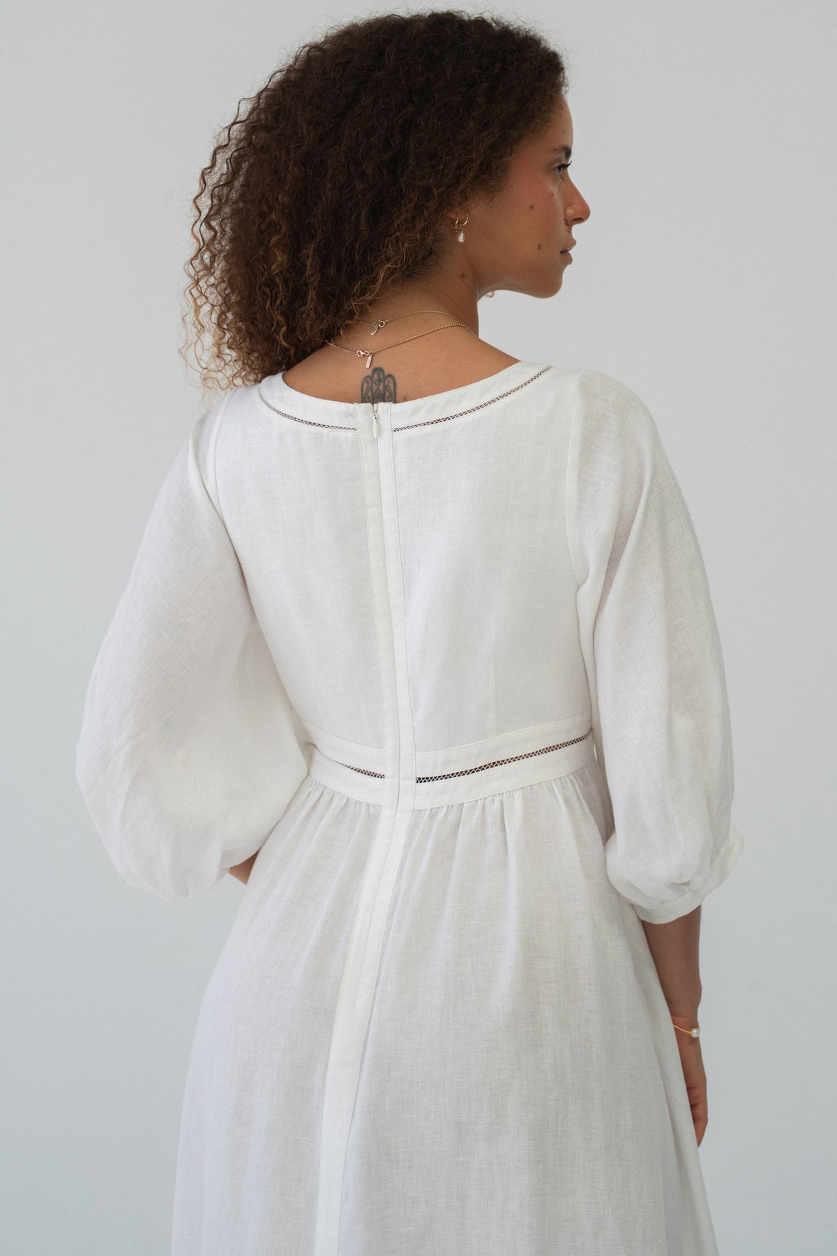 Josie Linen Midi Dress in Ivory - back view showing ladder lace trim detail and puff sleeves - Lilly Pilly Collection