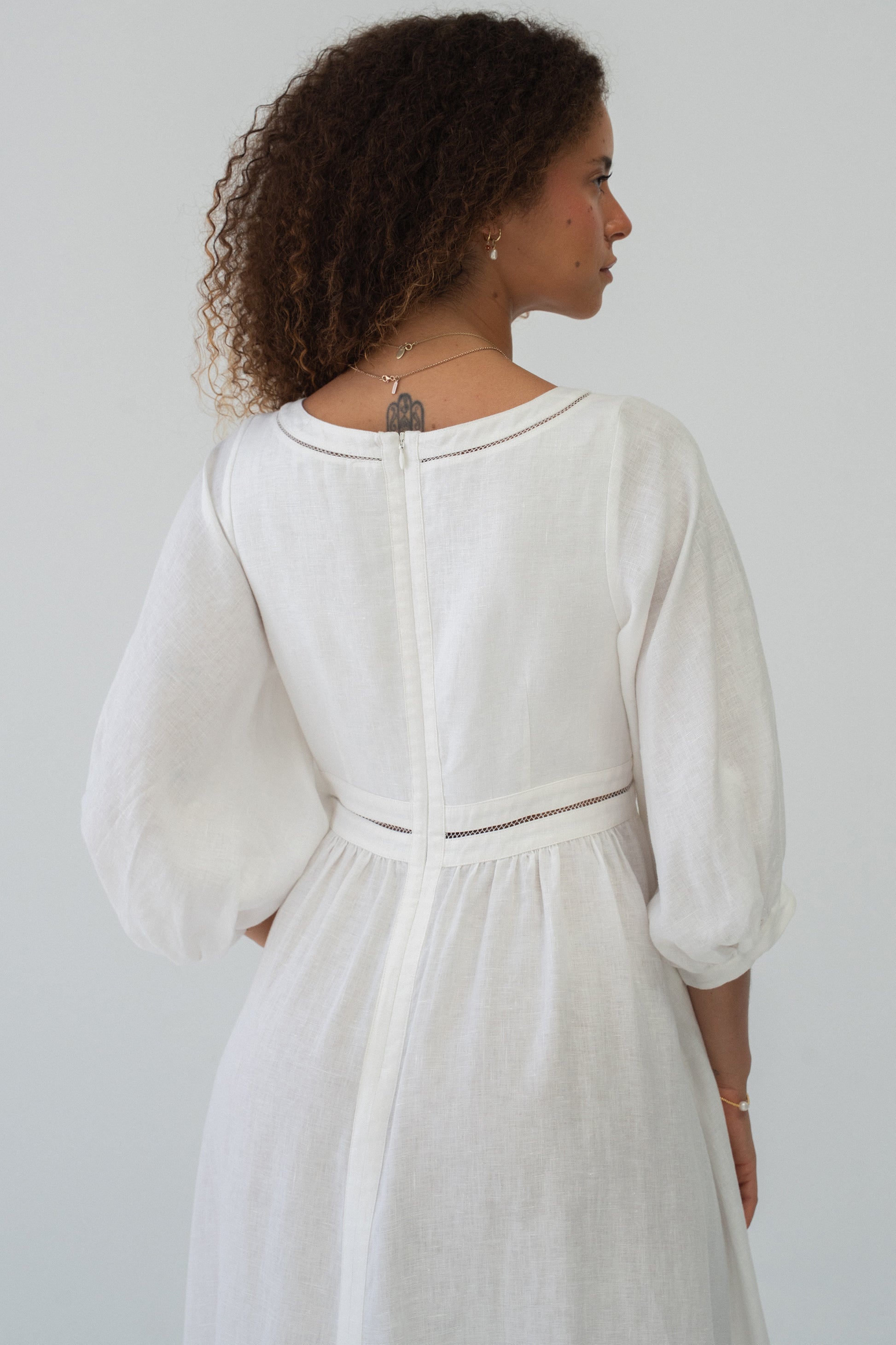 Josie Linen Midi Dress in Ivory - back view showing ladder lace trim detail and puff sleeves - Lilly Pilly Collection