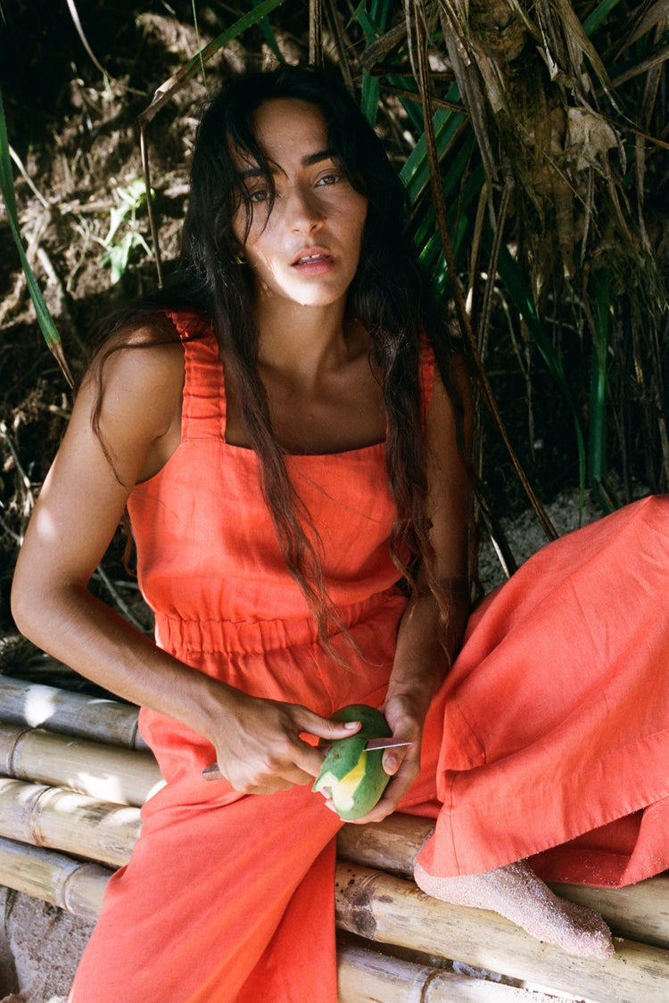 Front view of a woman wearing the Keely Linen jumpsuit in Spritz Orange - Lilly Pilly Collection