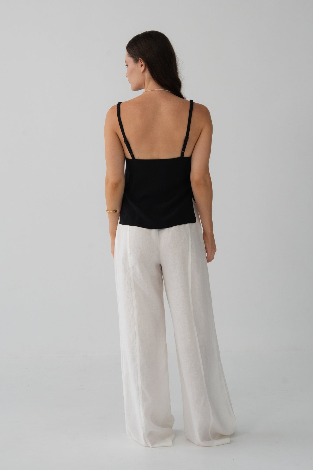 Leni Silk Cami in Black - back detail, open back and thin straps, gold necklace - Lilly Pilly Collection
