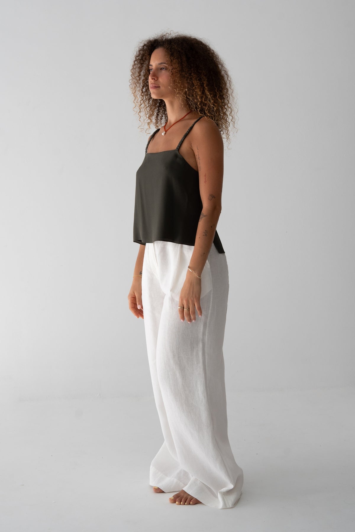 Leni Silk Cami in Khaki - side view, thin straps, worn with Oli Pants in Ivory - Lilly Pilly Collection