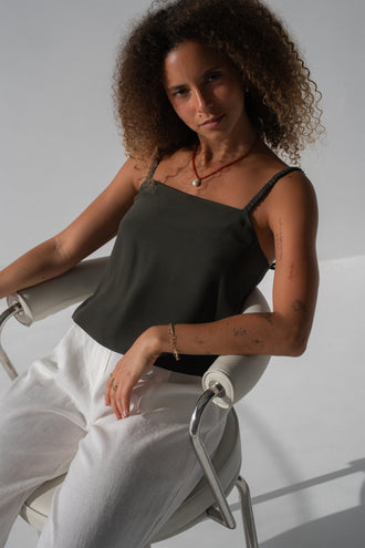 Leni Silk Cami in Khaki - seated, square neckline and thin straps, worn with Oli Pants in Ivory, pearl pendant necklace - Lilly Pilly Collection