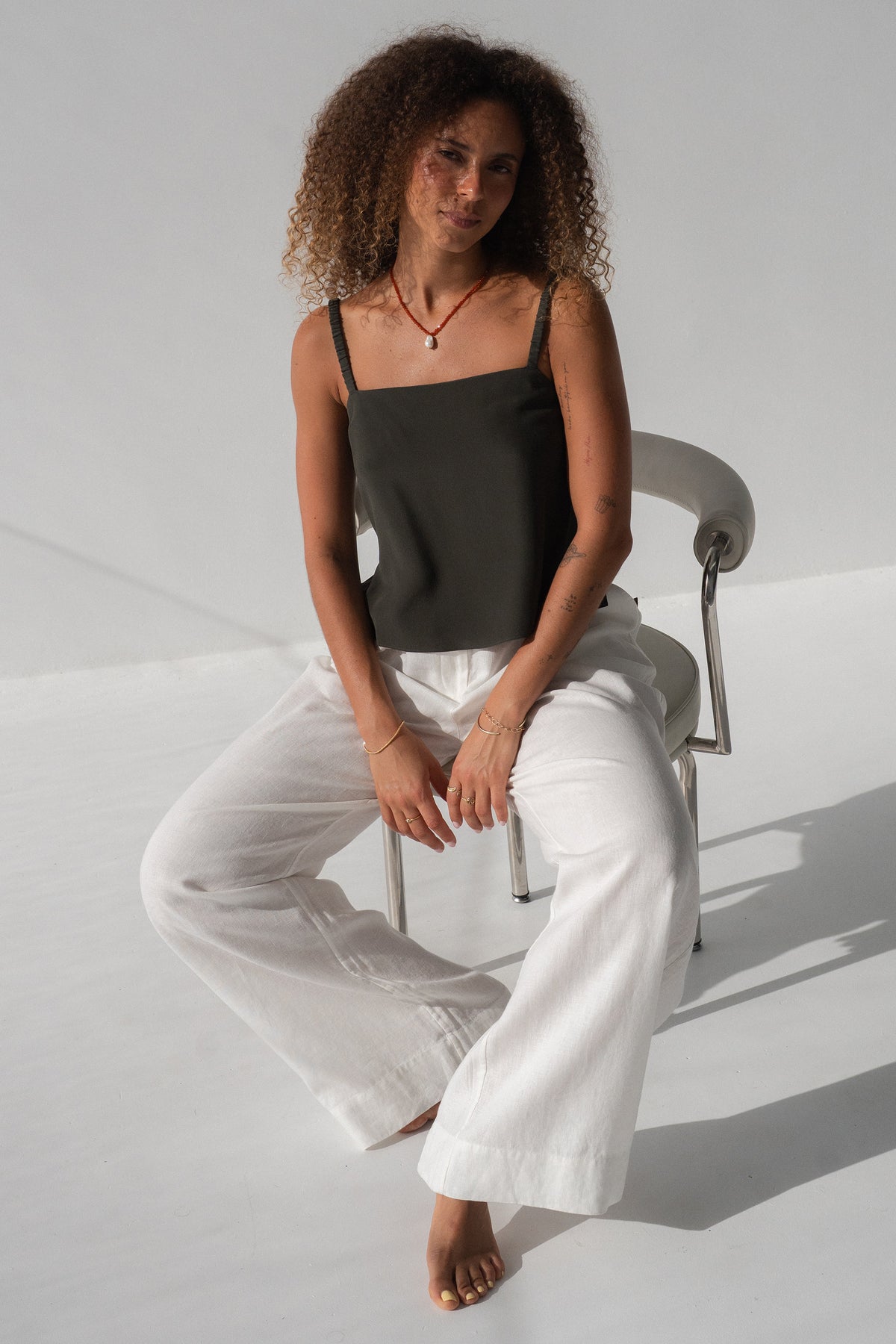 Leni Silk Cami in Khaki - seated, square neckline and thin straps, worn with Oli Pants in Ivory - Lilly Pilly Collection