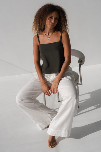 Leni Silk Cami in Khaki - seated, square neckline and thin straps, worn with Oli Pants in Ivory - Lilly Pilly Collection