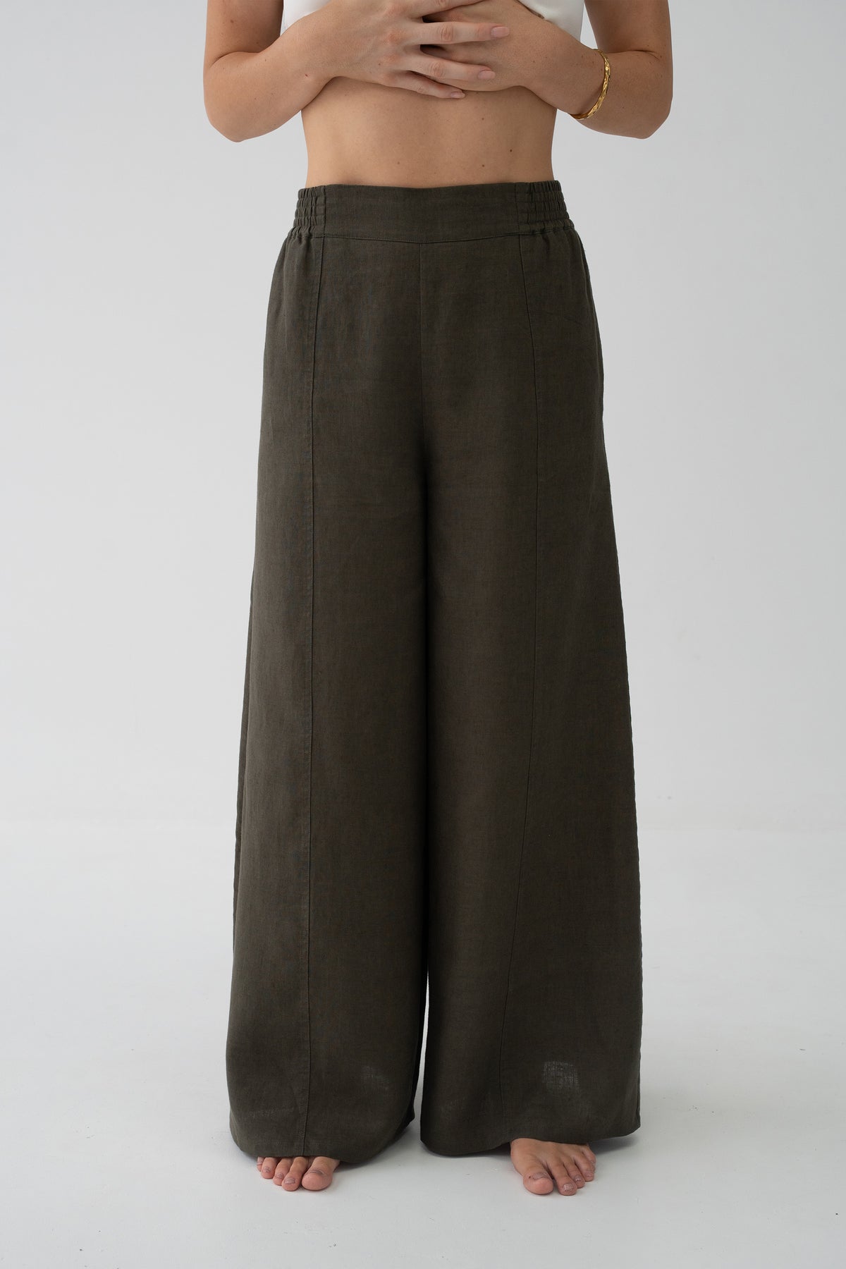 Letty Linen Pants in Khaki - close-up of elasticated waistband and wide-leg linen silhouette, studio setting - Lilly Pilly Collection
