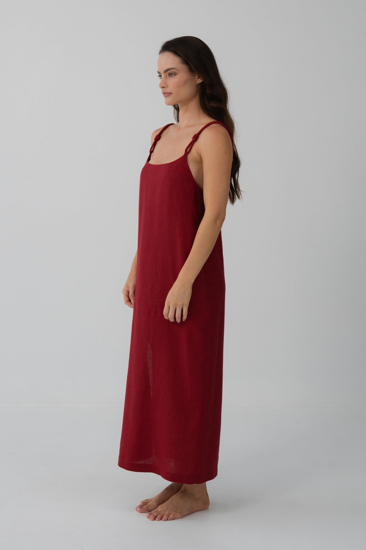 Lia Linen Midi Slip Dress in Cherry Red - side profile, fluid midi length and knotted straps - Lilly Pilly Collection