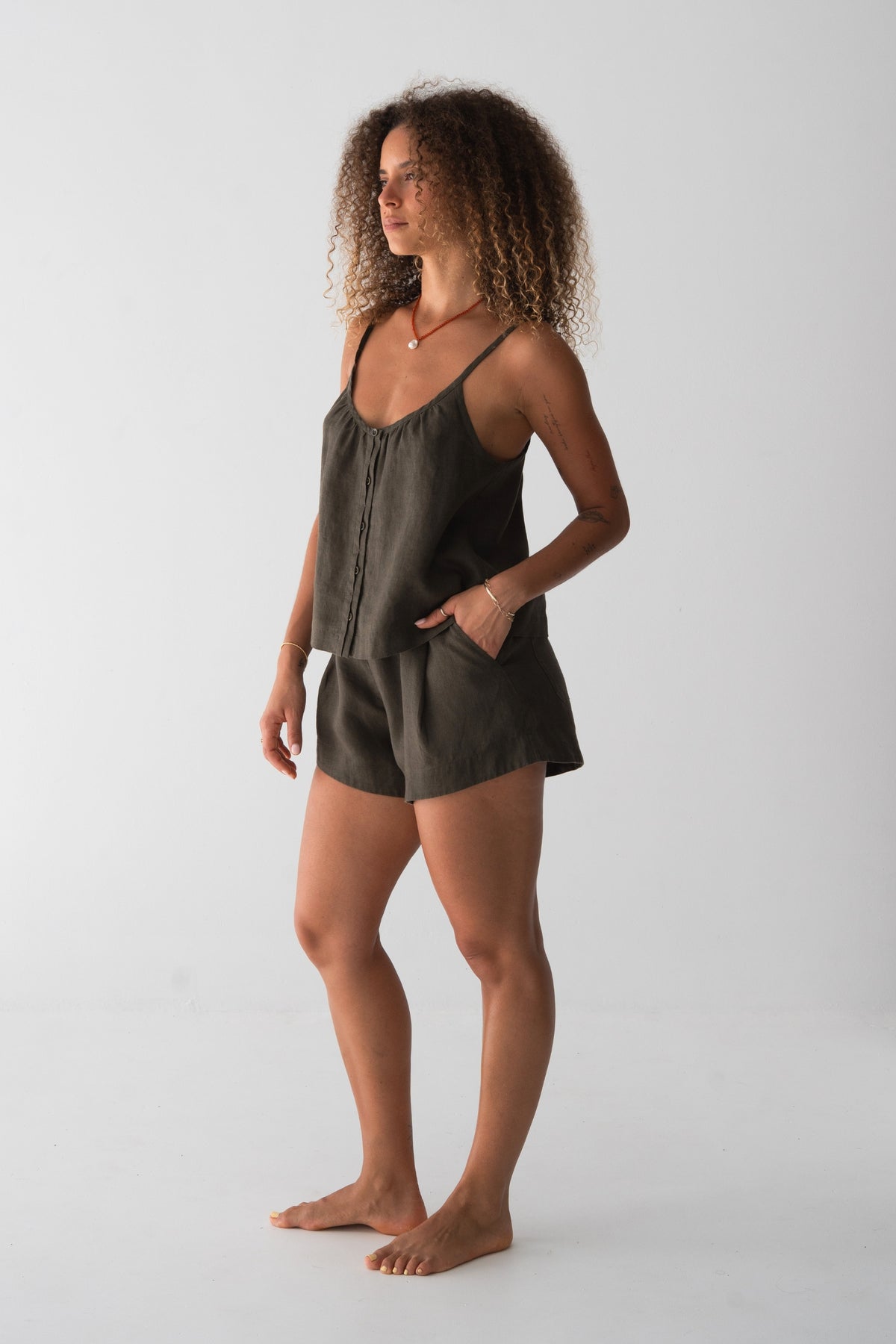 Lola Linen Cami in Khaki - side profile, hand in pocket, styled with matching Gaia Linen Shorts - Lilly Pilly Collection