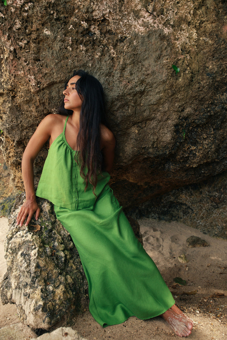 Lola Linen Cami in Lime Green - woman leaning on rock, gathered scoop neckline, styled with matching Riley Linen Maxi Skirt, sandstone backdrop - Lilly Pilly Collection