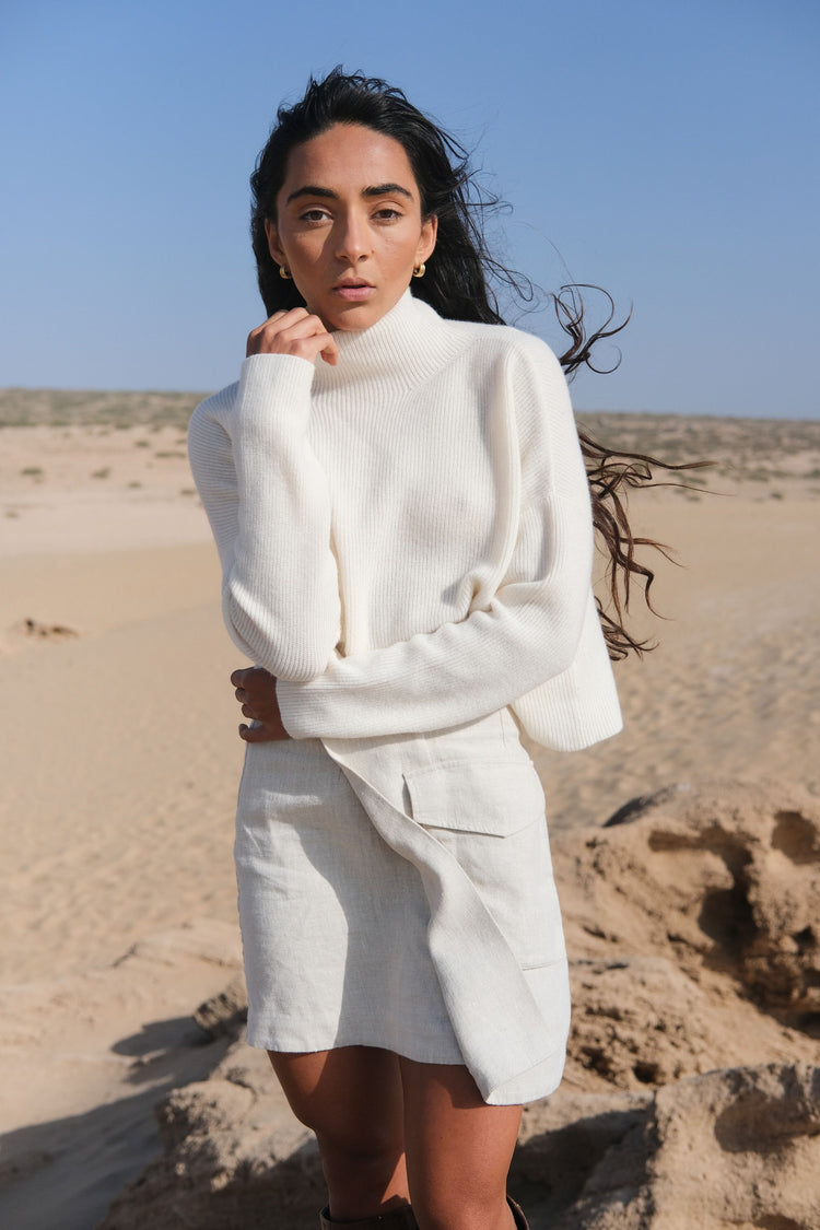 Lumi Cashmere Knit in Ivory - front view, standing in a desert landscape - Lilly Pilly Collection