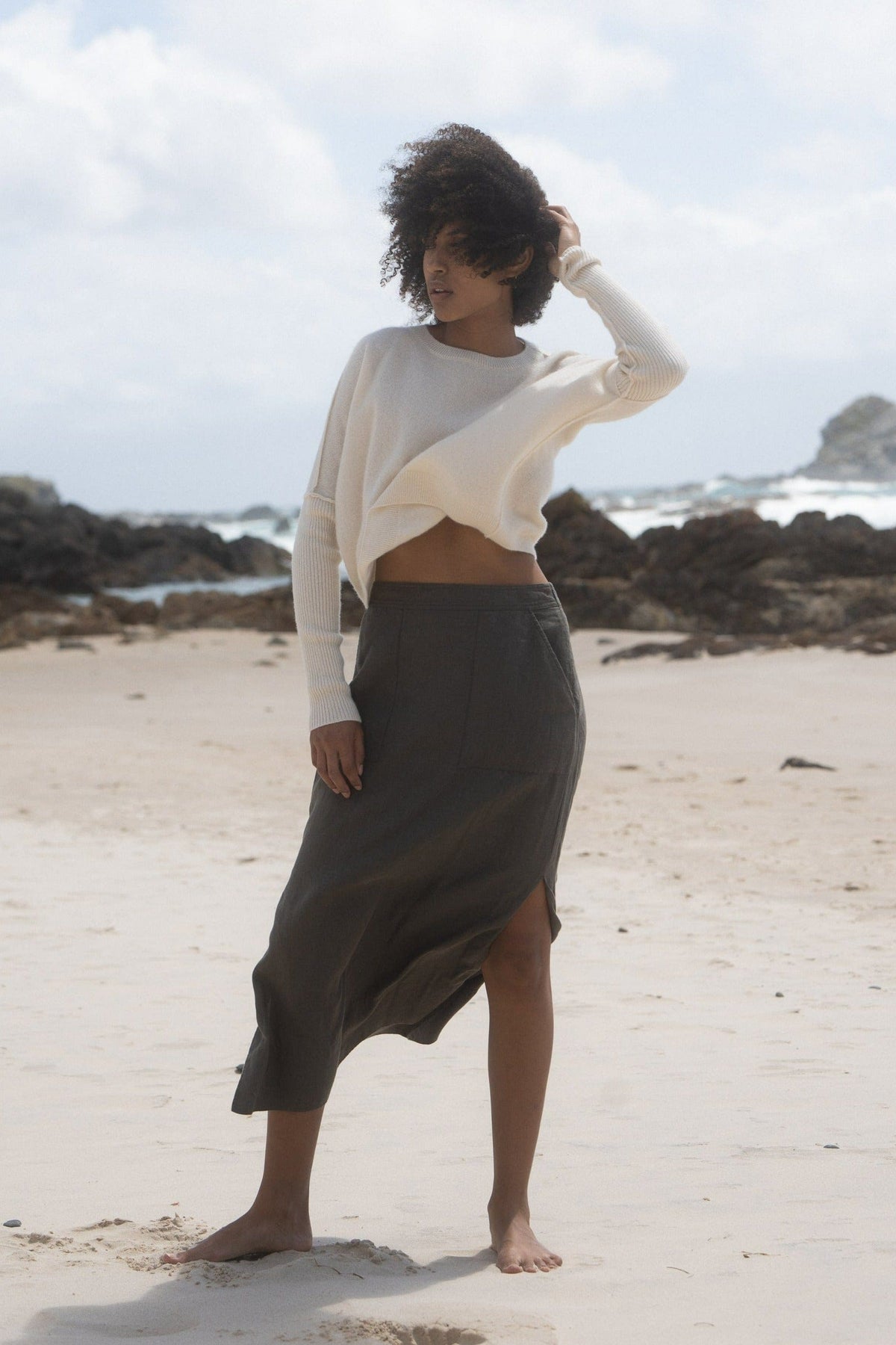 LILLY PILLY Collection NEW Miri Knit made from 100% cashmere in Ivory on a beach