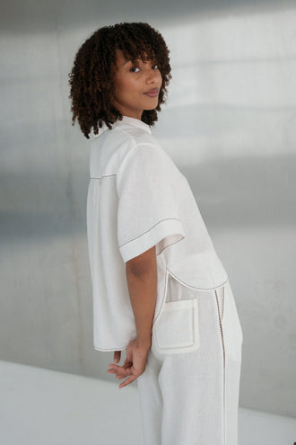 Nika Linen Shirt in Ivory - front view, styled with Ivy linen pants, minimalistic setting - Lilly Pilly Collection
