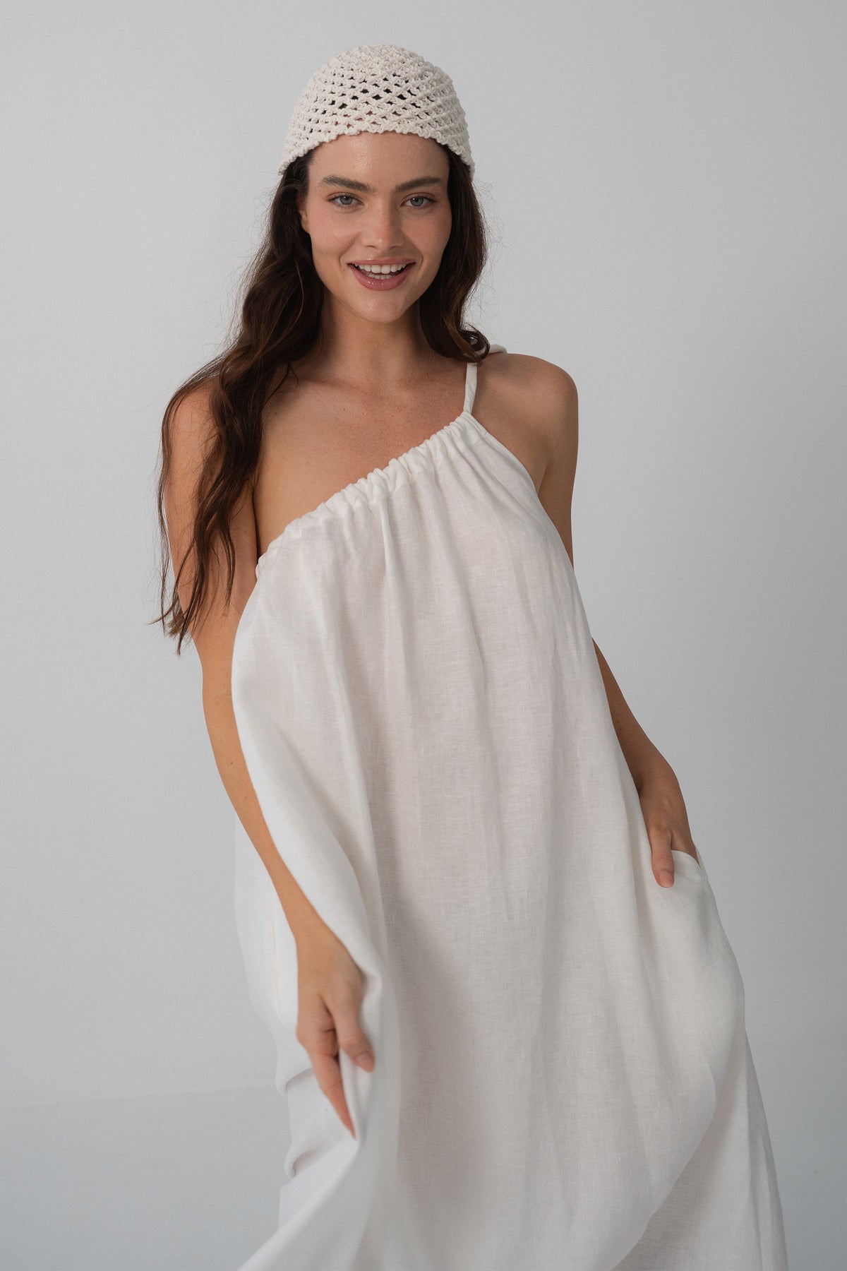 Ophelia Linen Midi Dress in Ivory - close-up of asymmetric gathered neckline, crochet headband styling - Lilly Pilly Collection