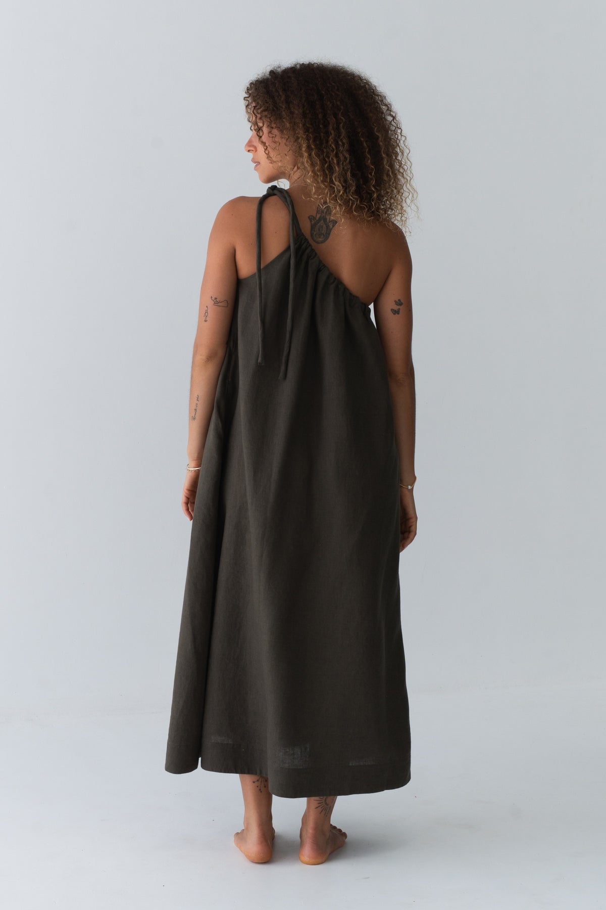Ophelia Linen Midi Dress in Khaki - back view, open back with tie strap and voluminous midi length - Lilly Pilly Collection
