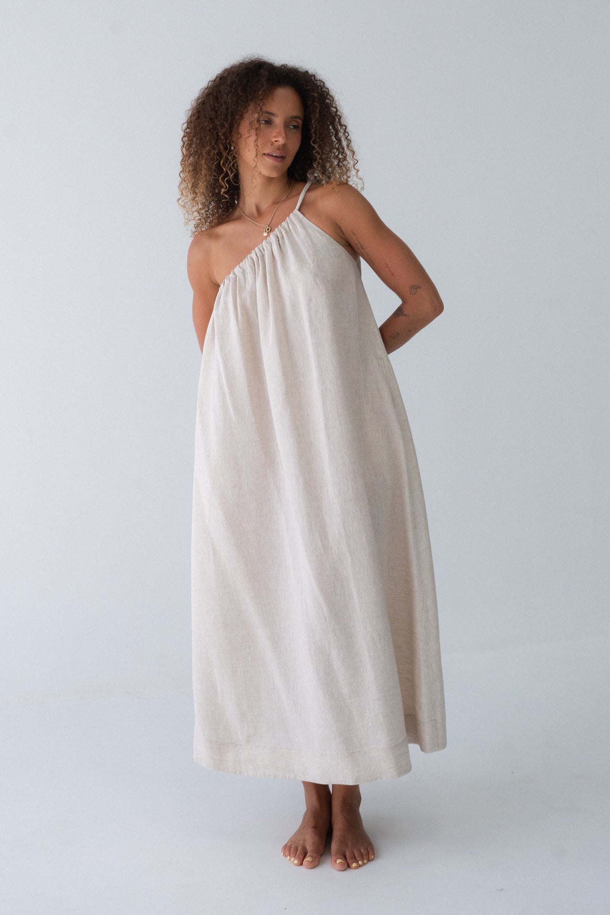 Ophelia Linen Midi Dress in Oatmeal - full length view, asymmetric gathered neckline and voluminous A-line midi - Lilly Pilly Collection