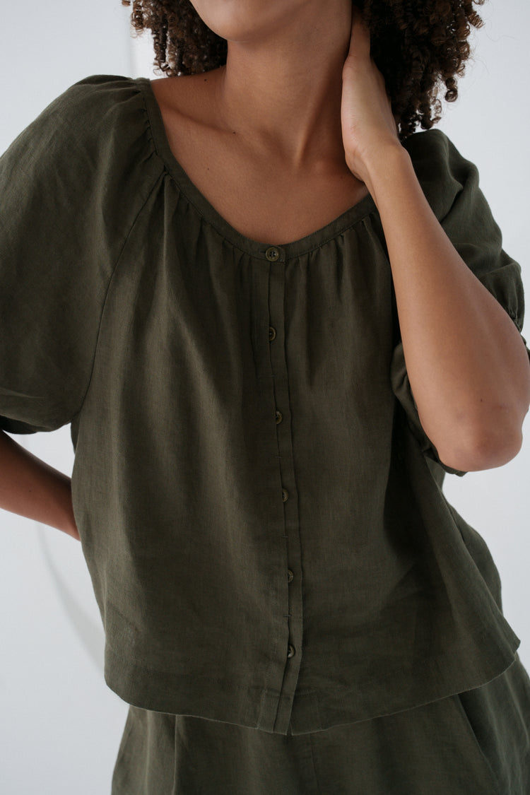 Pia Linen Top in Khaki - close-up of gathered scoop neckline and button-front placket, styled with matching linen shorts - Lilly Pilly Collection