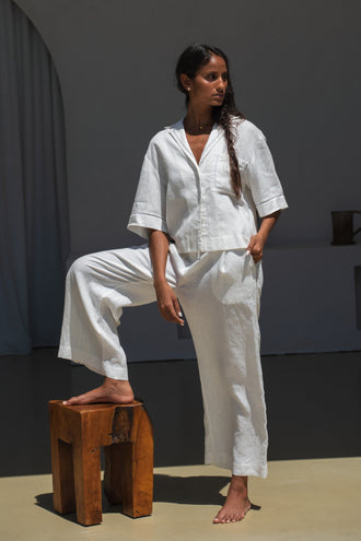 Rika Linen Pants in Ivory - front view standing against a white wall - Lilly Pilly Collection