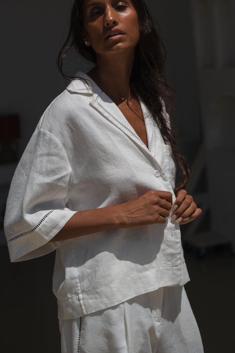 Quinn Linen Shirt in Ivory - close up view paired with matching Rika ivory pants in a studio setting - Lilly Pilly Collection