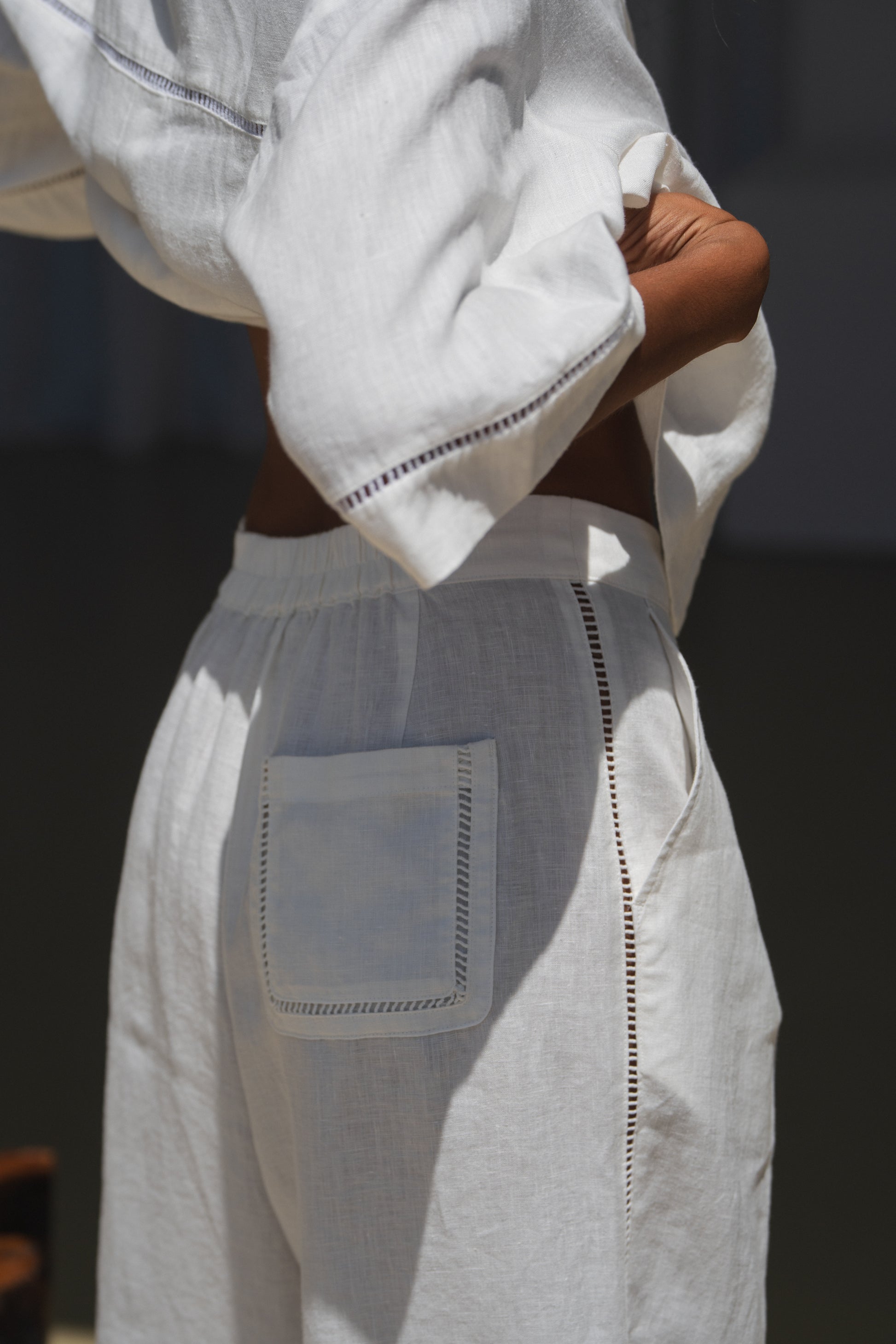 Woman in a ivory Rika linen pants and Quinn shirt
