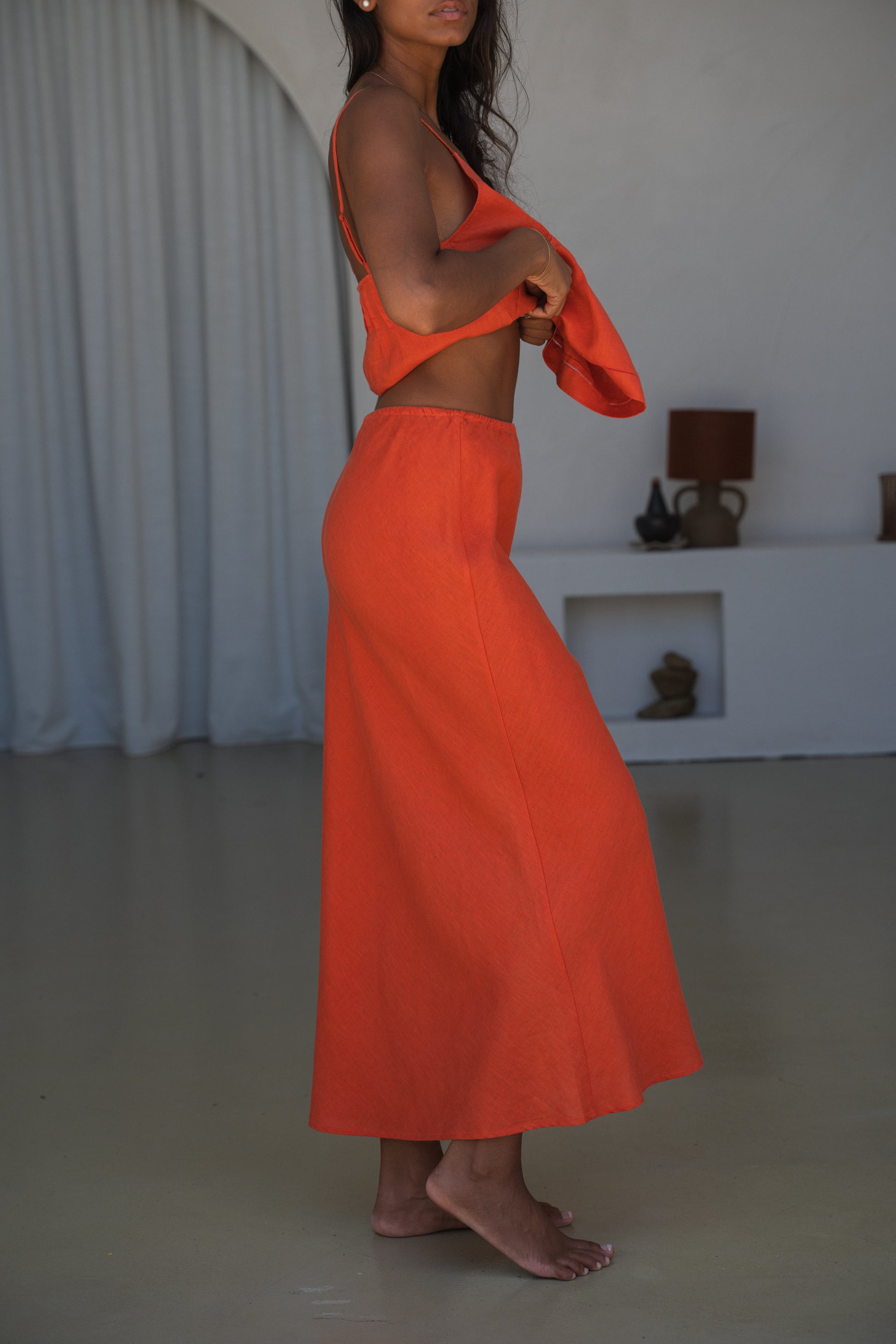 LILLY PILLY woman wearing Riley linen skirt in Spritz , side view