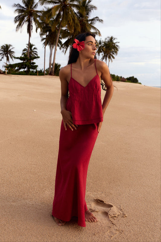 Riley Bias Linen Midi Skirt in Cherry Red - full length, bias-cut midi length, worn with Leni Silk Cami in Cherry Red, hibiscus flower, palm tree backdrop - Lilly Pilly Collection