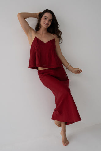 Riley Bias Linen Midi Skirt in Cherry Red - full length front view, woman wearing Cherry Red linen skirt with matching silk cami, studio setting - Lilly Pilly Collection
