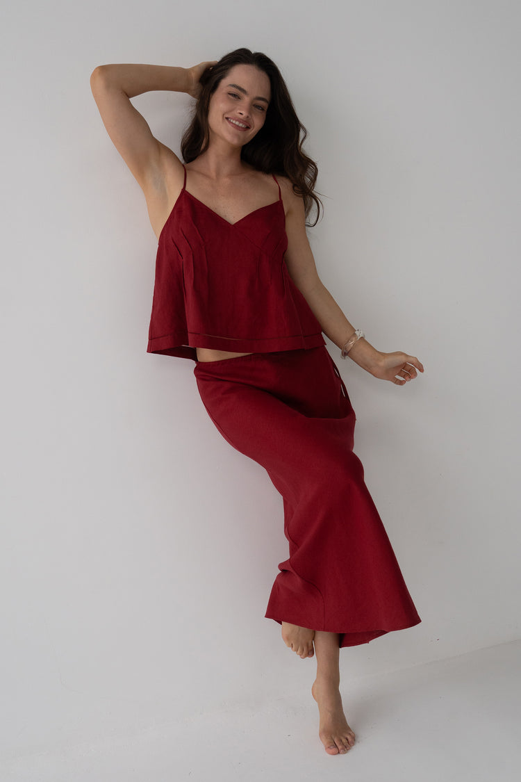 Riley Bias Linen Midi Skirt in Cherry Red - full length front view, woman wearing Cherry Red linen skirt with matching silk cami, studio setting - Lilly Pilly Collection
