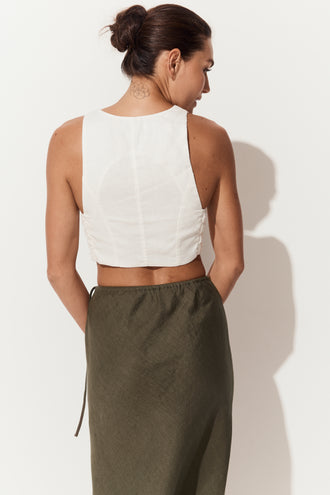 Riley Bias Linen Midi Skirt in Khaki - close up back view of woman wearing skirt paired with Ari linen ivory vest - Lilly Pilly Collection