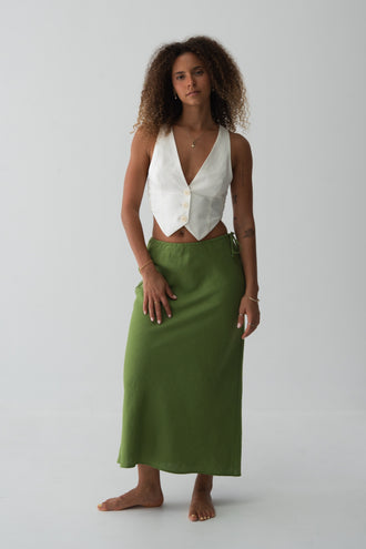 Riley Bias Linen Midi Skirt in Lime Green - full length front view, bias-cut midi length, side tie detail, worn with ivory waistcoat crop top, gold necklace - Lilly Pilly Collection