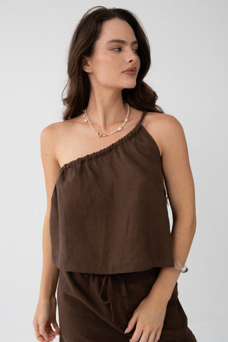 Romy Linen Top in Chocolate - close-up, one-shoulder gathered neckline, styled with Anelle Linen Mini Skirt in Chocolate - Lilly Pilly Collection