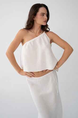 Romy Linen Top in Ivory - three-quarter view, one-shoulder gathered neckline, styled with ivory Riley Linen Maxi Skirt - Lilly Pilly Collection