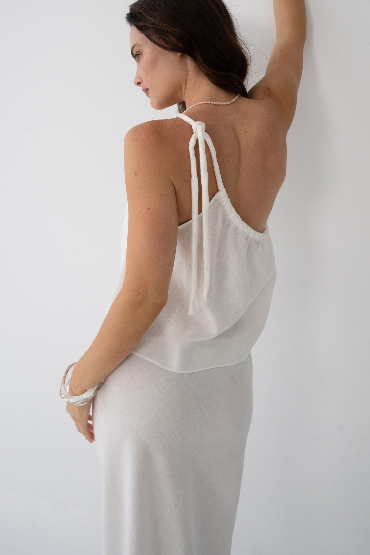 Romy Linen Top in Ivory - back view, open tie-back detail, styled with ivory Riley Linen Maxi Skirt - Lilly Pilly Collection