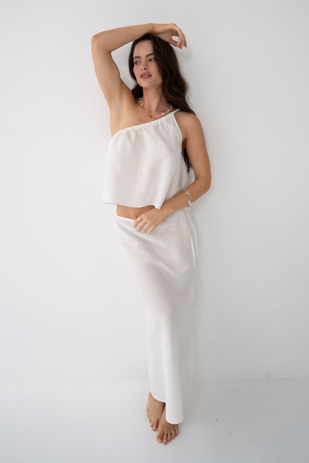 Romy Linen Top in Ivory - full length, one-shoulder silhouette, styled with ivory Riley Linen Maxi Skirt - Lilly Pilly Collection