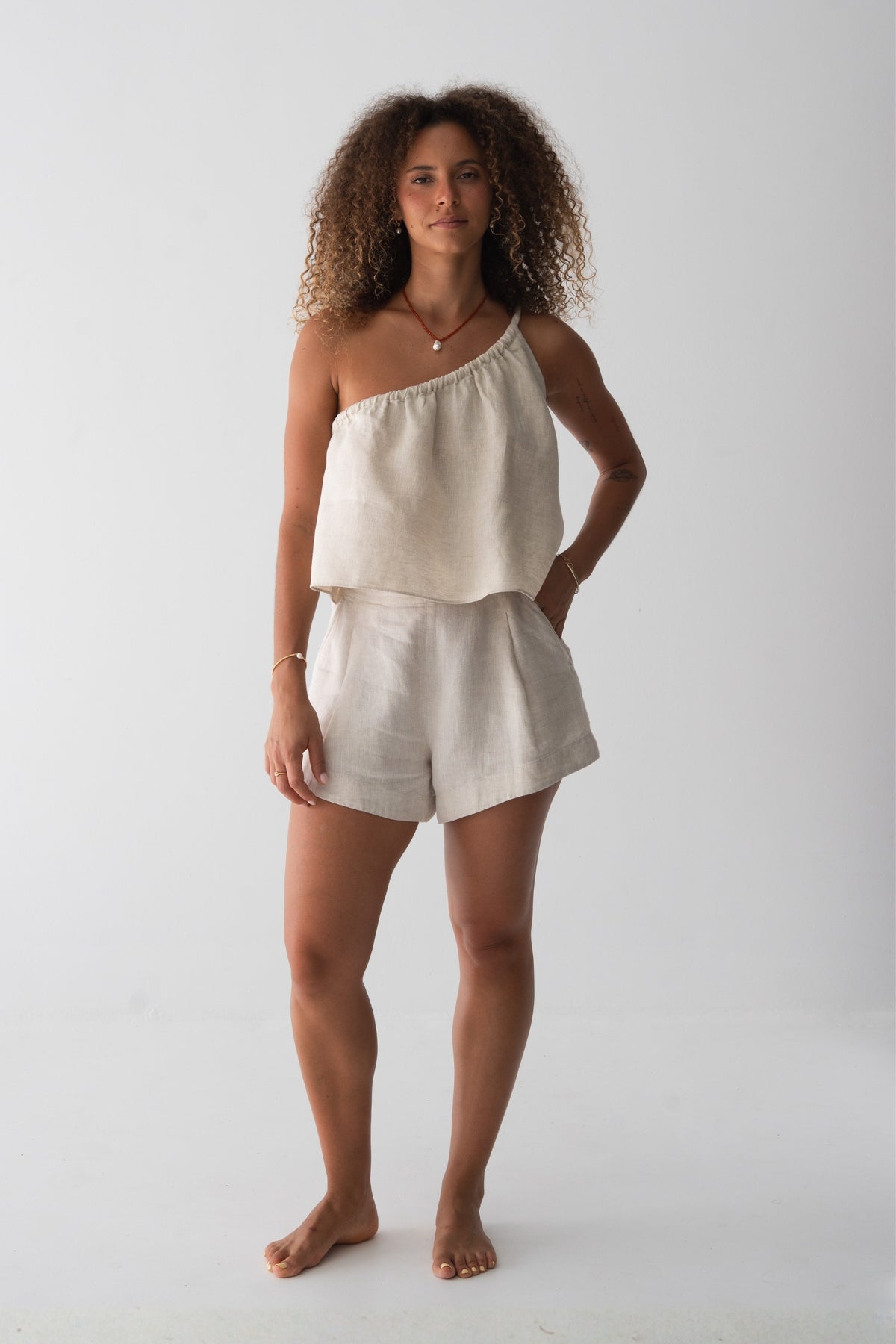 Romy Linen Top in Oatmeal - full length front view, one-shoulder gathered neckline, styled with matching Gaia Linen Shorts - Lilly Pilly Collection