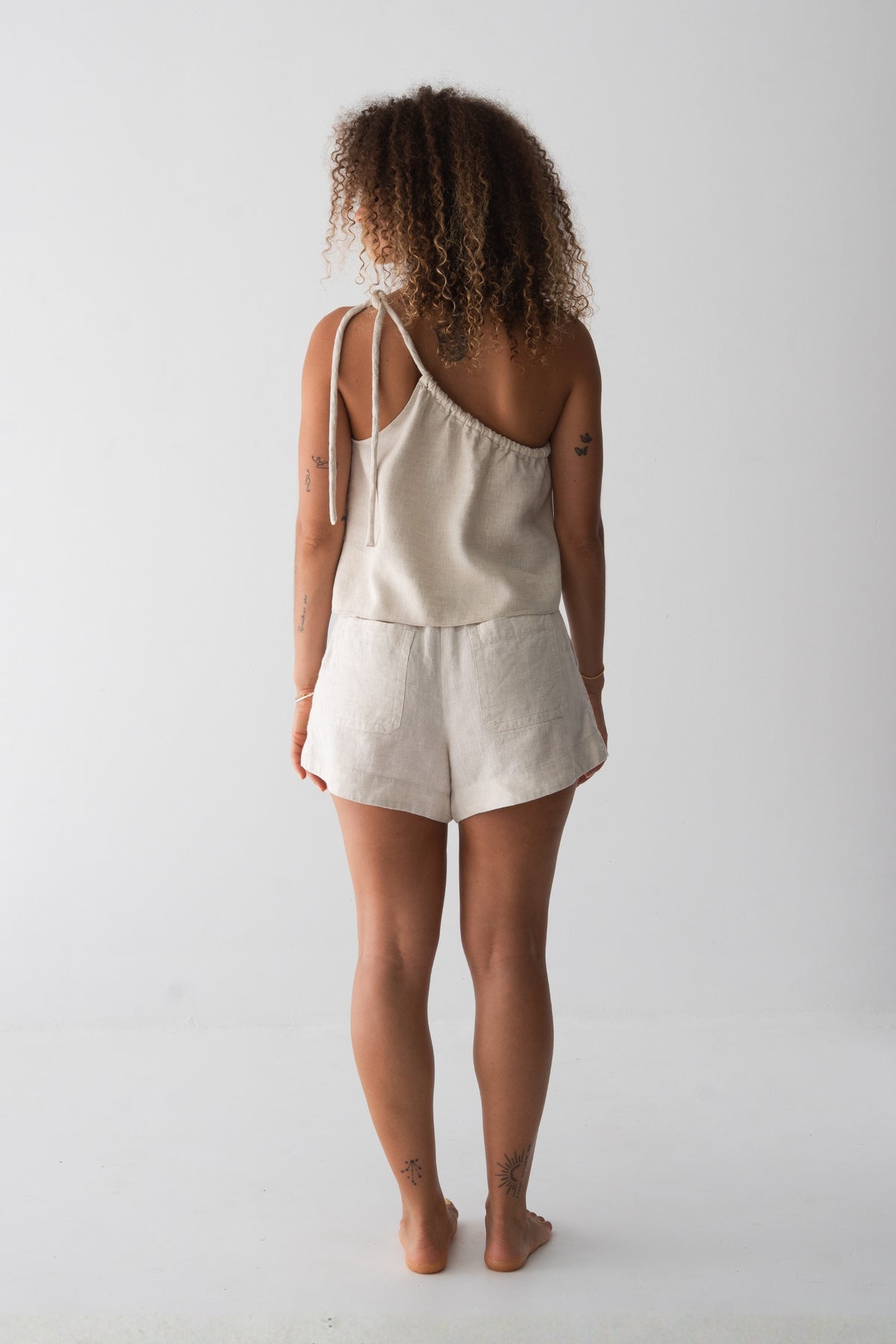 Romy Linen Top in Oatmeal - back view, open back with tie detail, styled with matching Gaia Linen Shorts - Lilly Pilly Collection