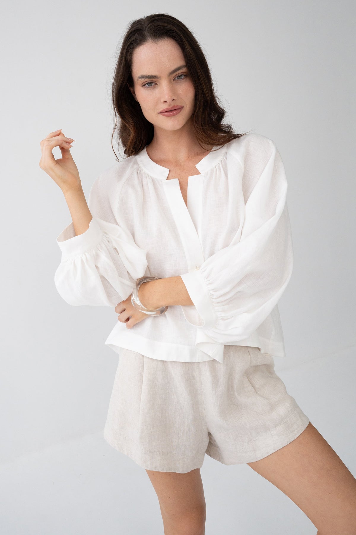 Rowan Linen Shirt in Ivory - close-up of puff sleeves, styled with Gaia Linen Shorts in Oatmeal - Lilly Pilly Collection

