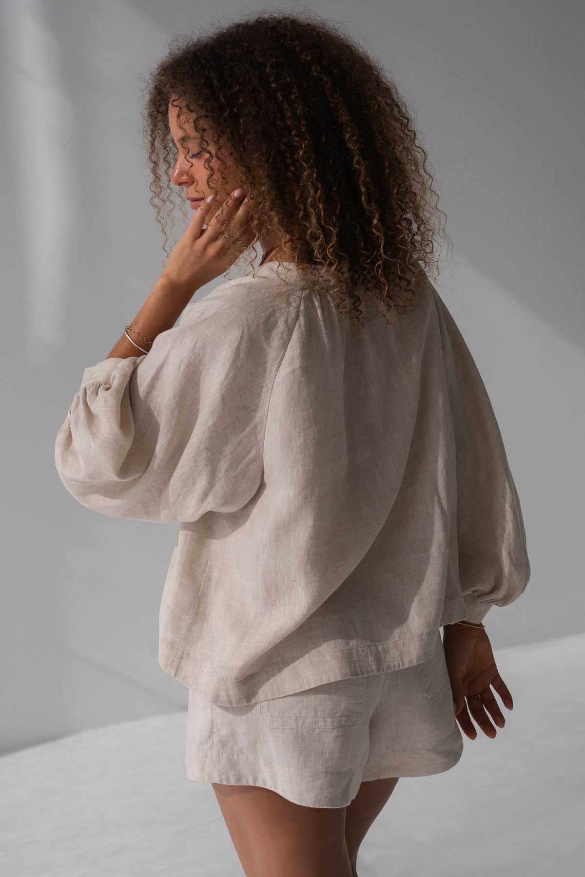 Rowan Linen Shirt in Oatmeal - back view, voluminous puff sleeves with elasticated cuffs, styled with matching linen shorts - Lilly Pilly Collection