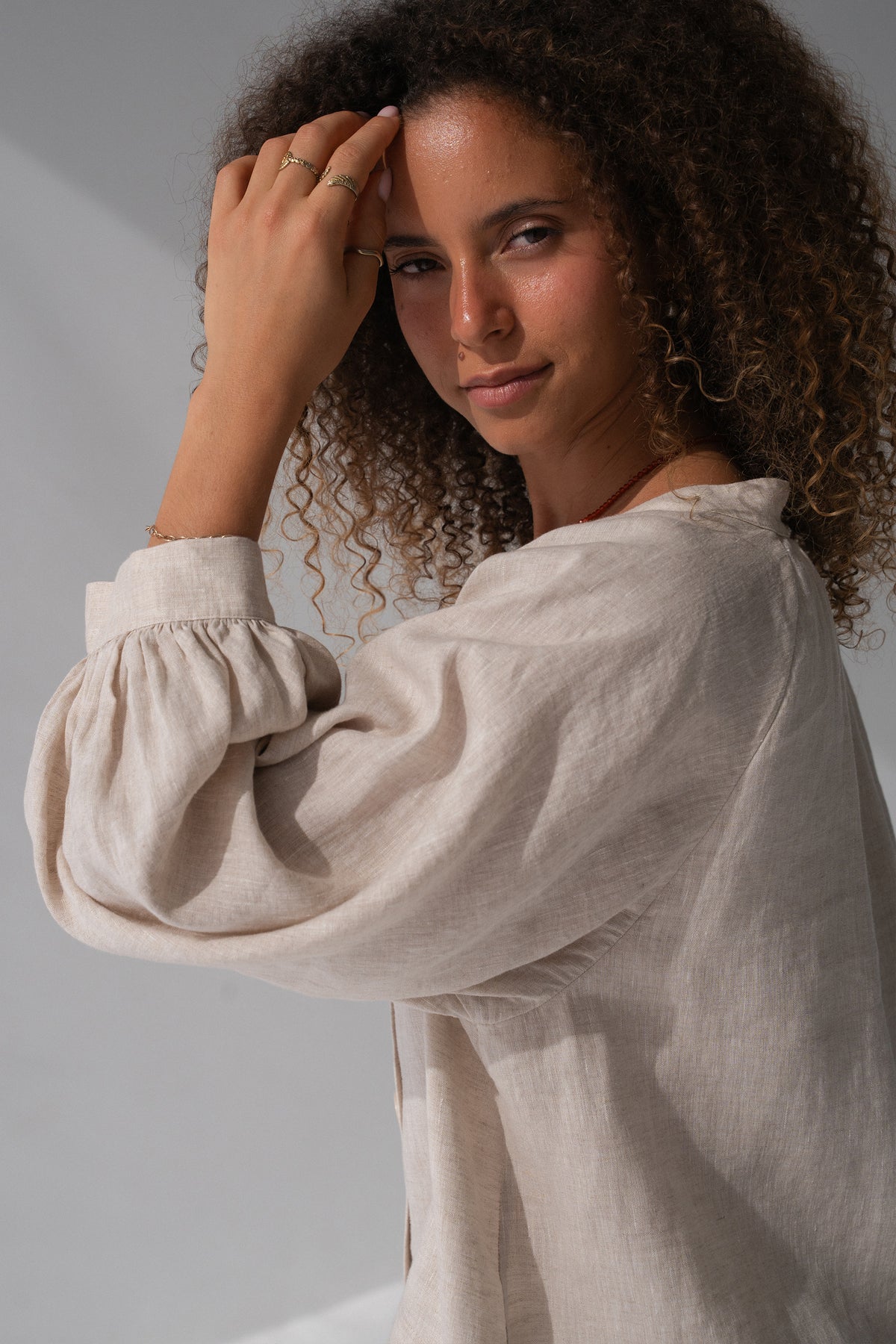 Rowan Linen Shirt in Oatmeal - close-up of V-neckline and puff sleeve with elasticated cuff - Lilly Pilly Collection