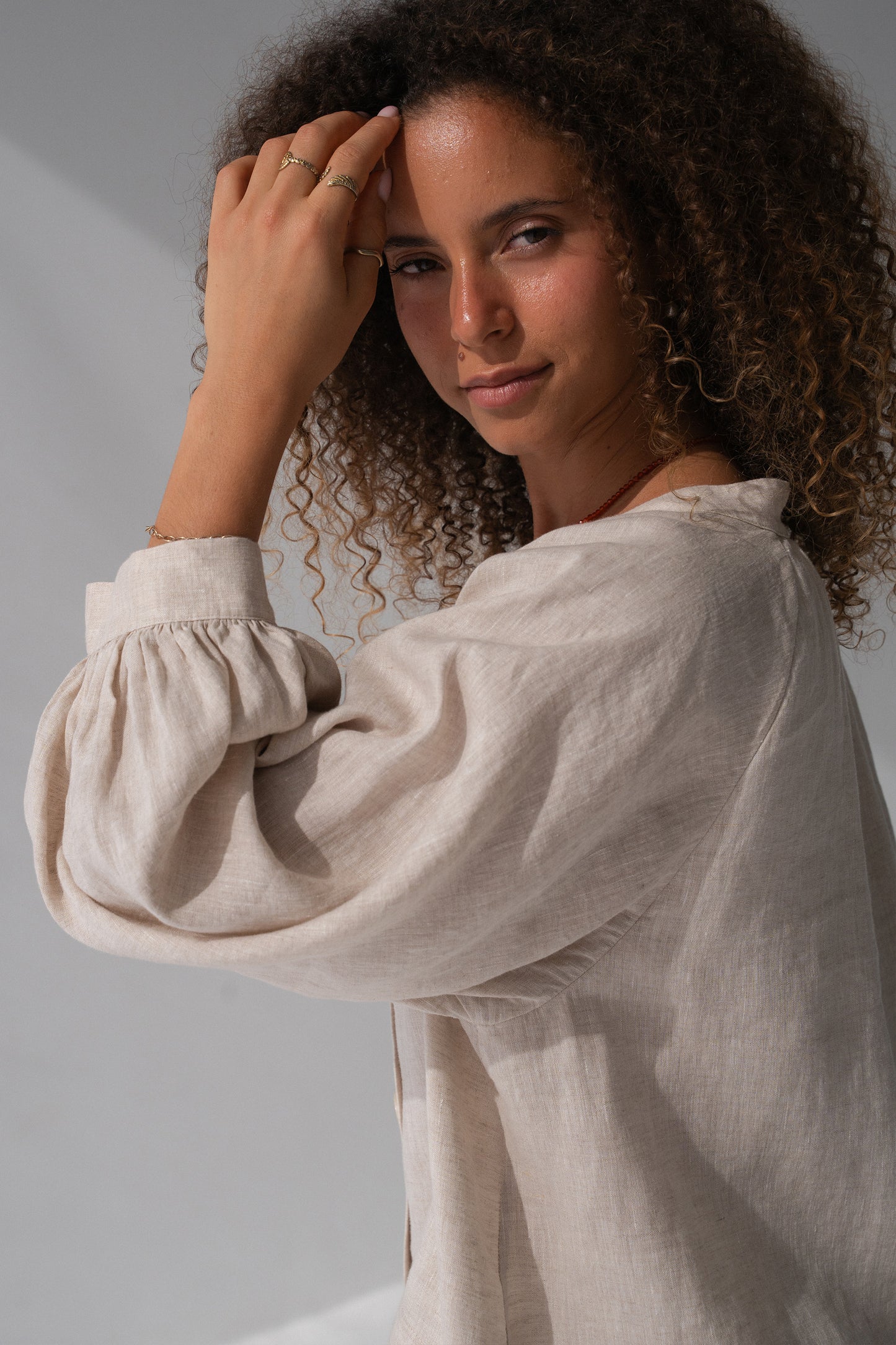 Rowan Linen Shirt in Oatmeal - close-up of V-neckline and puff sleeve with elasticated cuff - Lilly Pilly Collection
