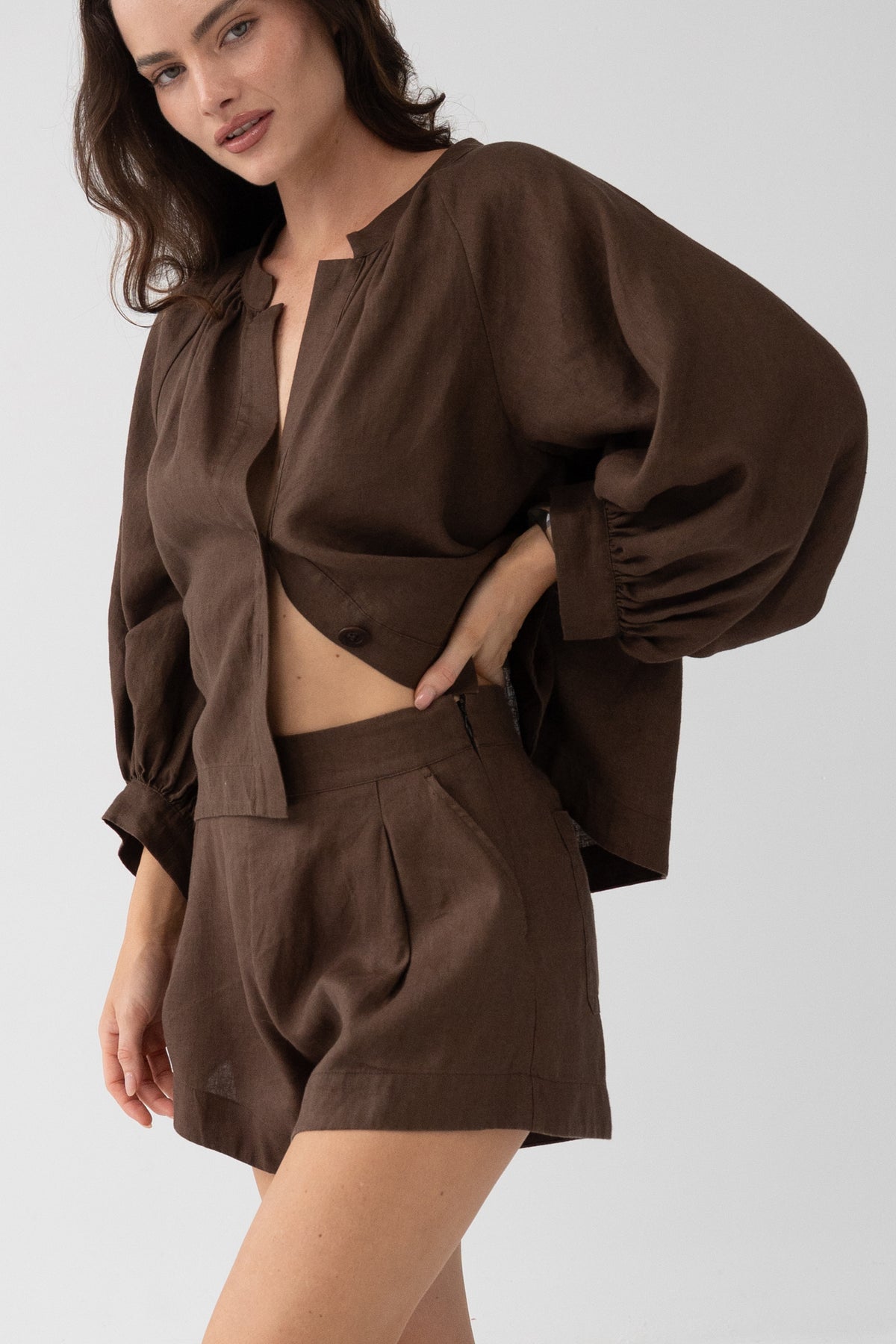 Rowan Linen Shirt in Chocolate - three-quarter view, open button-front and cropped hem, styled with matching linen shorts - Lilly Pilly Collection