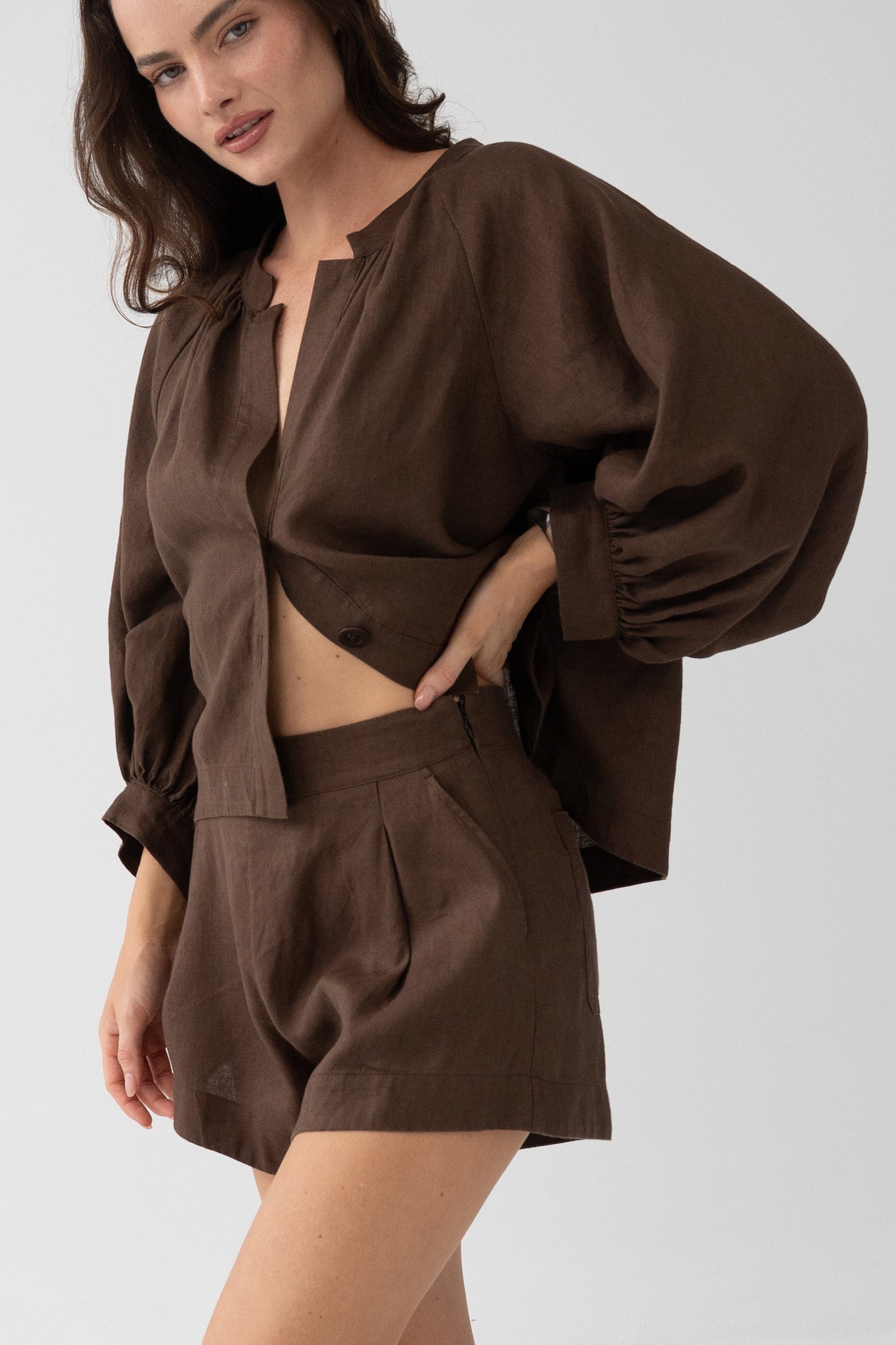 Rowan Linen Shirt in Chocolate - three-quarter view, open button-front and cropped hem, styled with matching linen shorts - Lilly Pilly Collection