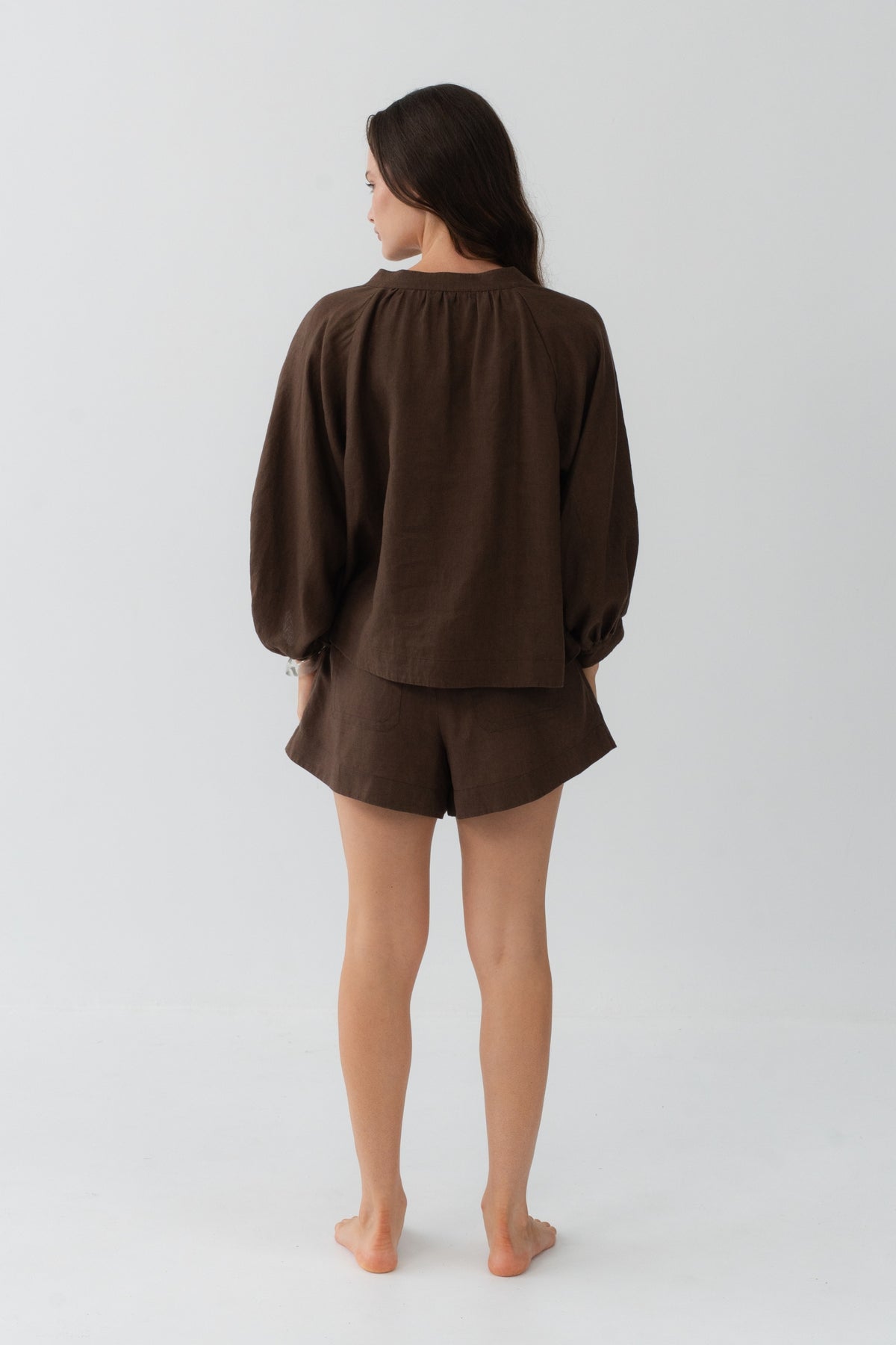 Rowan Linen Shirt in Chocolate - back view, gathered back yoke and puff sleeves, styled with matching linen shorts - Lilly Pilly Collection