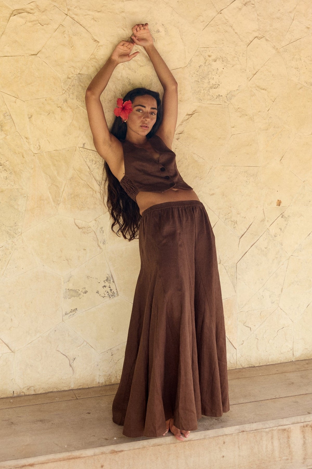 Stella Linen Maxi Skirt in Chocolate - full length, woman wearing matching Chocolate linen waistcoat, beach setting with horse - Lilly Pilly Collection